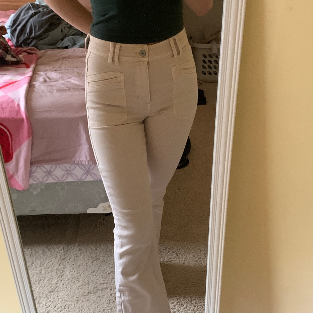 American Eagle cream colored flare jeans